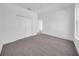 Spacious bedroom featuring neutral carpet, ceiling fan, and large closet for ample storage at 17135 Sw 41 Ct, Ocala, FL 34473