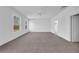 Spacious bedroom featuring soft carpet flooring, ceiling fan and a natural light from two windows at 17135 Sw 41 Ct, Ocala, FL 34473