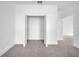 Bedroom closet with double doors and plush carpet inside at 17135 Sw 41 Ct, Ocala, FL 34473