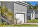 Close up of the white two-car garage door and number on a modern home at 17135 Sw 41 Ct, Ocala, FL 34473