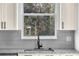 Modern kitchen faucet with a window view of the trees at 17135 Sw 41 Ct, Ocala, FL 34473