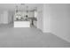 Open-concept kitchen with island, stainless appliances, and marble tile floors at 17135 Sw 41 Ct, Ocala, FL 34473