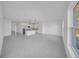 Spacious living area flows into the kitchen featuring lots of natural light at 17135 Sw 41 Ct, Ocala, FL 34473