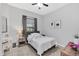 Inviting bedroom with plush carpeting, neutral walls, and a comfortable bed near a window at 1817 Snaresbrook Way, Orlando, FL 32837