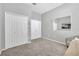 Spacious bedroom with multiple closets, neutral paint, and plush carpeting, offering ample storage and comfort at 1817 Snaresbrook Way, Orlando, FL 32837