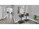Open-concept kitchen with a granite-topped breakfast bar and two barstools, seamlessly connecting to the living space at 1817 Snaresbrook Way, Orlando, FL 32837