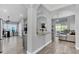 Open-concept kitchen with granite countertops, stainless steel appliances, and seamless flow to living area at 1817 Snaresbrook Way, Orlando, FL 32837