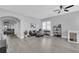Spacious living room with modern gray tones, wood-look floors, and an open layout at 1817 Snaresbrook Way, Orlando, FL 32837