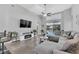 Spacious living room with a modern sectional sofa, fireplace, and sliding glass doors to the outdoor area at 1817 Snaresbrook Way, Orlando, FL 32837