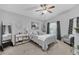 Inviting main bedroom with a comfortable bed, decorative mirror, and large window, creating a relaxing retreat at 1817 Snaresbrook Way, Orlando, FL 32837