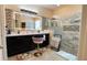 Modern bathroom boasting a double sink vanity, contemporary lighting, and a glass-enclosed walk-in shower at 1855 Partin Terrace Rd, Kissimmee, FL 34744