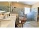 Modern bathroom with a double vanity, sleek lighting, and a glass-enclosed walk-in shower at 1855 Partin Terrace Rd, Kissimmee, FL 34744