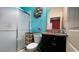 This bathroom features a glass-enclosed shower and a decorative seashell wreath at 1855 Partin Terrace Rd, Kissimmee, FL 34744