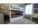 This bedroom includes a white bunk bed with a basketball hoop on top bunk at 1855 Partin Terrace Rd, Kissimmee, FL 34744