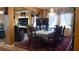 Elegant dining room featuring decorative accents, including a chandelier, connecting to the living room at 1855 Partin Terrace Rd, Kissimmee, FL 34744