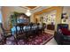 Charming dining room with elegant furnishings, a decorative chandelier, and seamless flow to the adjacent living space at 1855 Partin Terrace Rd, Kissimmee, FL 34744