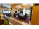 Open-concept dining room featuring a stunning chandelier, large windows, and seamless connection to the living area at 1855 Partin Terrace Rd, Kissimmee, FL 34744