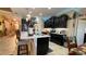 Well-lit kitchen featuring a large island, pendant lighting, and a stainless steel refrigerator at 1855 Partin Terrace Rd, Kissimmee, FL 34744