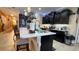 Contemporary kitchen featuring a large center island, pendant lighting, and modern stainless steel appliances at 1855 Partin Terrace Rd, Kissimmee, FL 34744