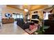 Bright living room featuring a decorative ceiling, a patterned rug, a sectional sofa, and lots of plants at 1855 Partin Terrace Rd, Kissimmee, FL 34744