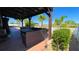 Outdoor seating area under a pergola overlooking a private backyard at 1855 Partin Terrace Rd, Kissimmee, FL 34744