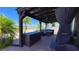 Covered outdoor patio with seating, a storage bench, and beautiful views at 1855 Partin Terrace Rd, Kissimmee, FL 34744
