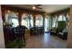 Bright sunroom with bar and dining areas, and large windows offering expansive views at 1855 Partin Terrace Rd, Kissimmee, FL 34744