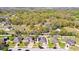 Aerial view of houses and neighborhood showcasing the tree coverage and general location at 188 Whispering Pines Way, Davenport, FL 33837