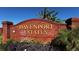 Entrance sign for Davenport Estates showcasing brick design and landscaped surroundings at 188 Whispering Pines Way, Davenport, FL 33837
