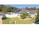 This home showcases solar panels, a fenced yard, and well-maintained landscaping at 188 Whispering Pines Way, Davenport, FL 33837