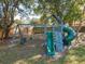 Outdoor play area featuring swings, a slide, and climbing structures for children at 210 Carriage Hill Dr, Casselberry, FL 32707