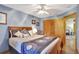 Bedroom featuring blue walls, a bed with accent pillows, and closet at 24 Cypress Ave, St Cloud, FL 34769