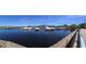 View of the marina with boats docked on the lake with a restaurant in the background at 24 Cypress Ave, St Cloud, FL 34769