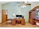 Functional home office with a spacious desk, storage, and a comfortable chair at 24 Cypress Ave, St Cloud, FL 34769