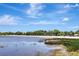 View of the beach and lakefront with trees lining the coast at 24 Cypress Ave, St Cloud, FL 34769