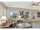 Serene sunroom with ample seating, large windows, and views of the outdoors at 24 Cypress Ave, St Cloud, FL 34769