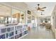 Bright sunroom with large windows, a ceiling fan, and a bookcase at 24 Cypress Ave, St Cloud, FL 34769