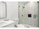 Bright bathroom features a glass-enclosed shower with marble tile and modern fixtures at 2555 Sweetwater Trl, Maitland, FL 32751