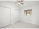 Bright bedroom with a ceiling fan, neutral walls, and double closets at 2555 Sweetwater Trl, Maitland, FL 32751