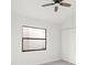 Bedroom with ceiling fan and window, allowing natural light to fill the space at 2555 Sweetwater Trl, Maitland, FL 32751