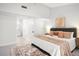 Bright bedroom with a ceiling fan, neutral decor, and an ensuite bathroom at 2555 Sweetwater Trl, Maitland, FL 32751
