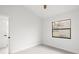 Clean bedroom featuring vinyl floors, closet, and plenty of natural light from the window at 2555 Sweetwater Trl, Maitland, FL 32751