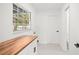Bright laundry room features a window, cabinets, and plenty of counter space at 2555 Sweetwater Trl, Maitland, FL 32751