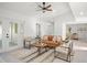 Spacious living room featuring a modern seating arrangement and neutral tones at 2555 Sweetwater Trl, Maitland, FL 32751