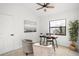 Bright office space with a ceiling fan, desk, seating, and a large window at 2555 Sweetwater Trl, Maitland, FL 32751