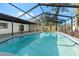 Inviting in-ground pool with screened enclosure, ideal for summer fun and relaxation at 2555 Sweetwater Trl, Maitland, FL 32751