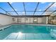Relaxing in-ground pool with large screened enclosure, perfect for outdoor entertainment at 2555 Sweetwater Trl, Maitland, FL 32751