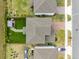 Aerial perspective of a home's backyard, including a gazebo, spa, seating area, and landscaping at 261 Whistling Duck Trl, St Cloud, FL 34771