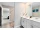 Well-lit bathroom features a double sink vanity and modern fixtures at 261 Whistling Duck Trl, St Cloud, FL 34771