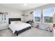 Bright and airy bedroom features two windows, neutral carpet, and rainbow decor at 261 Whistling Duck Trl, St Cloud, FL 34771